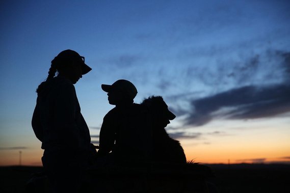 Ben Curuchet, 10, holds onto one of the dogs atop the four wheeler while talking to his mom Chris barely above a whisper on Thursday, June 10, 2021.