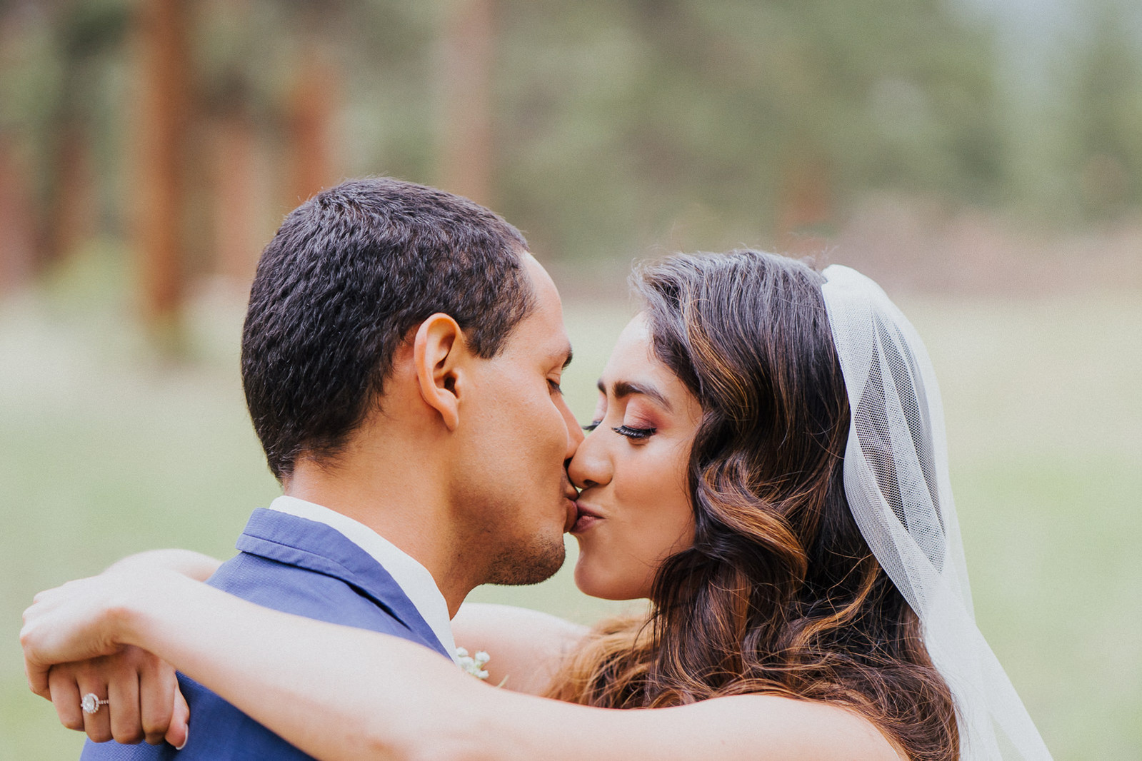 Wedding day kiss at Della Terra Mountain Chateau in Estes Park, Colorado. 
