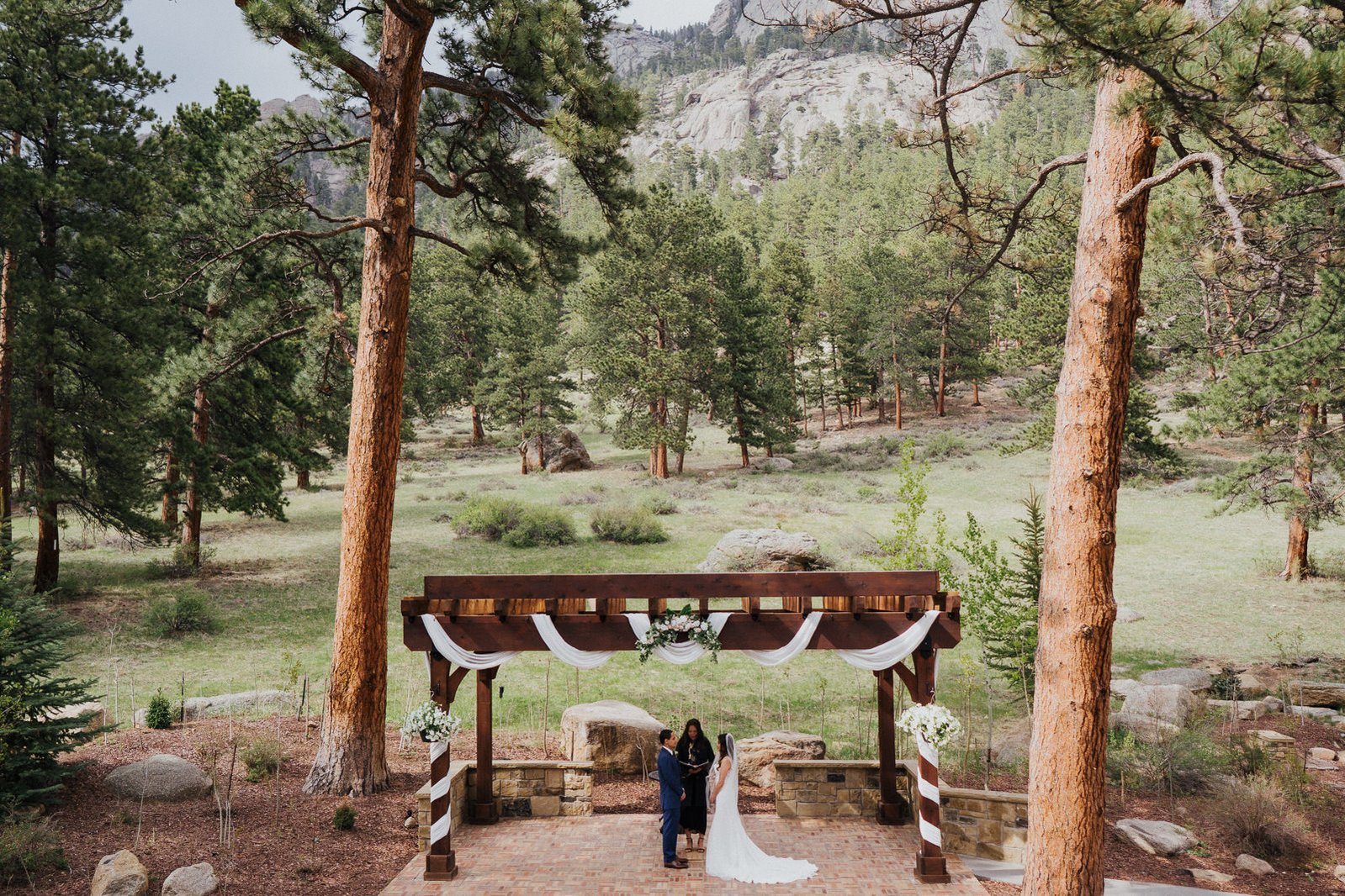 Wide ceremony photo. Della Terra Mountain Chateau, Estes Park, Colorado. 