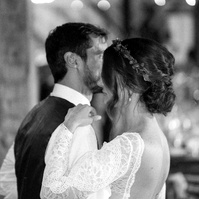 Black-and-white wedding reception kiss photographed with the Sony a7III for a real-world Sony a7III review by wedding photographer Nick Sparks.