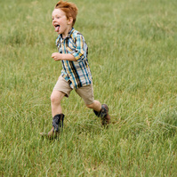 Child running at a wedding photographed with the Sony a7III showing autofocus tracking for a real-world Sony a7III review.