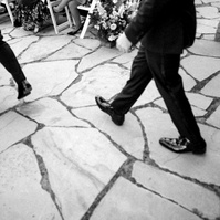 Black-and-white documentary wedding movement photographed with the Sony a7III showing real-world autofocus and wedding photography coverage.