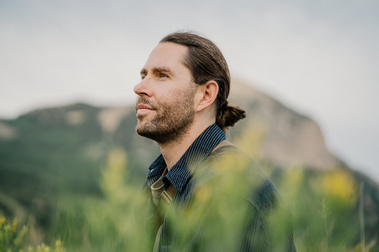 Portrait of Colorado wedding photographer Nick Sparks outdoors in the mountains near Denver, Colorado