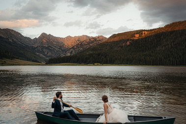Couple portrait in a canoe on a mountain lake in Colorado by Colorado wedding photographer Nick Sparks