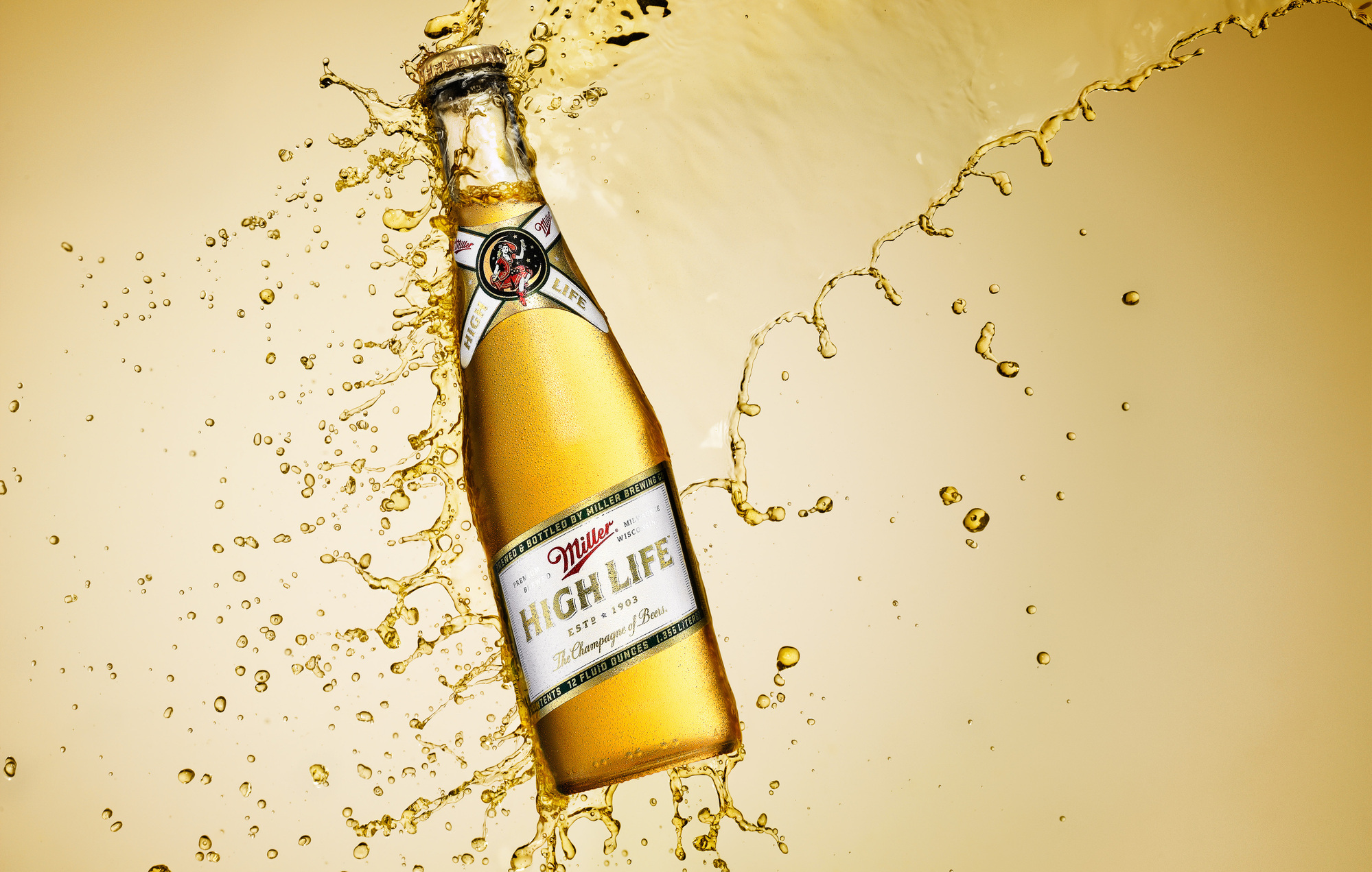 Miller High Life beer bottle splash photography by beverage product photographer Timothy Hogan