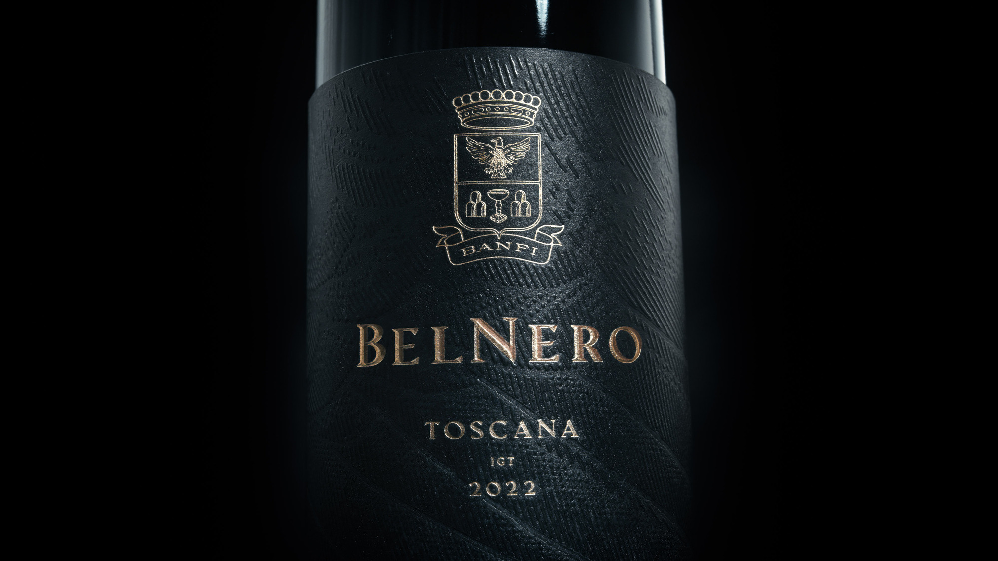 Macro advertising photography by Timothy Hogan of Banfi Estate Belnero Super Tuscan wine on a black background. 