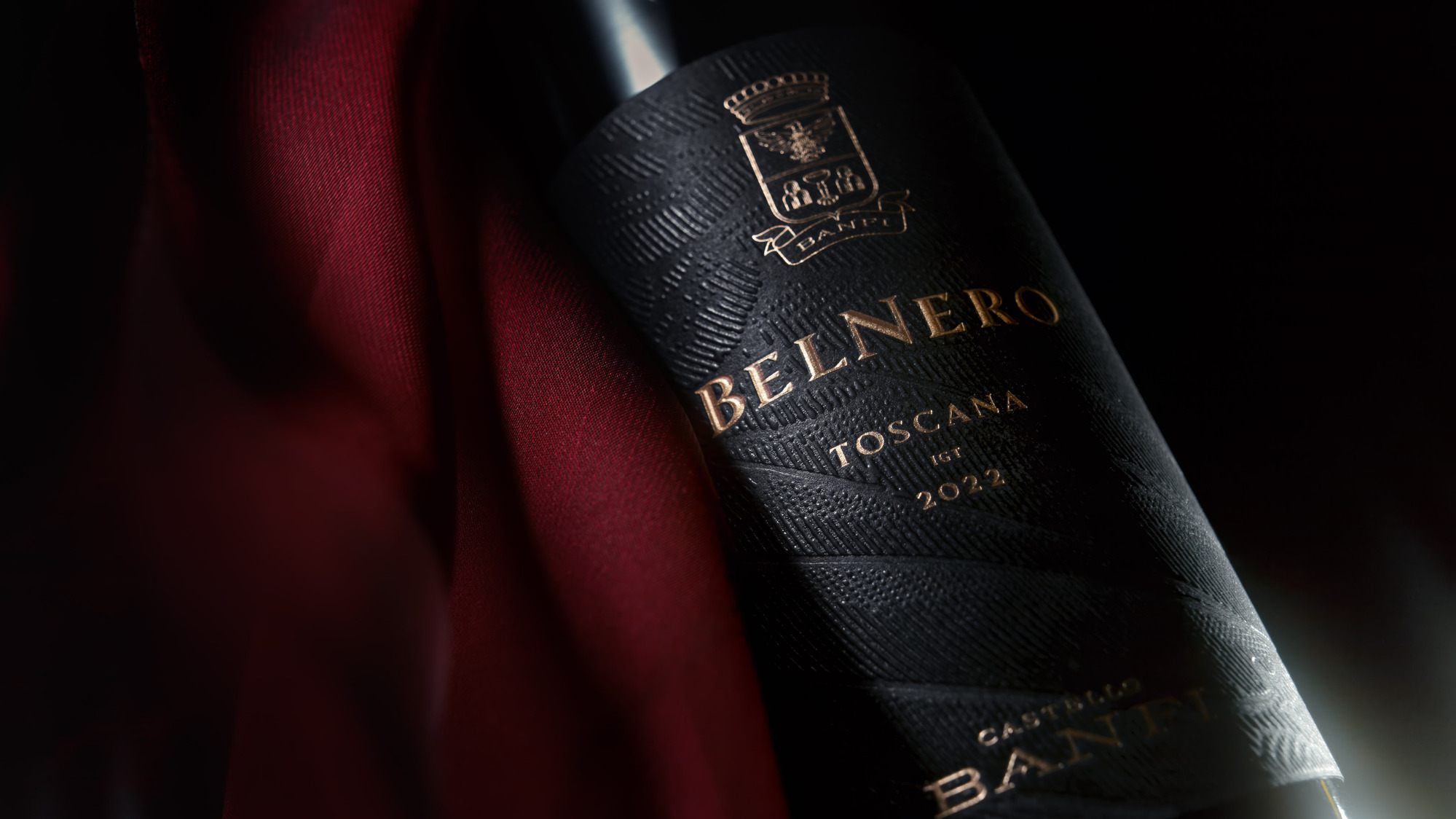 Closeup advertising photography hero image by Timothy Hogan of Banfi Estate Belnero Super Tuscan wine on a black background. 