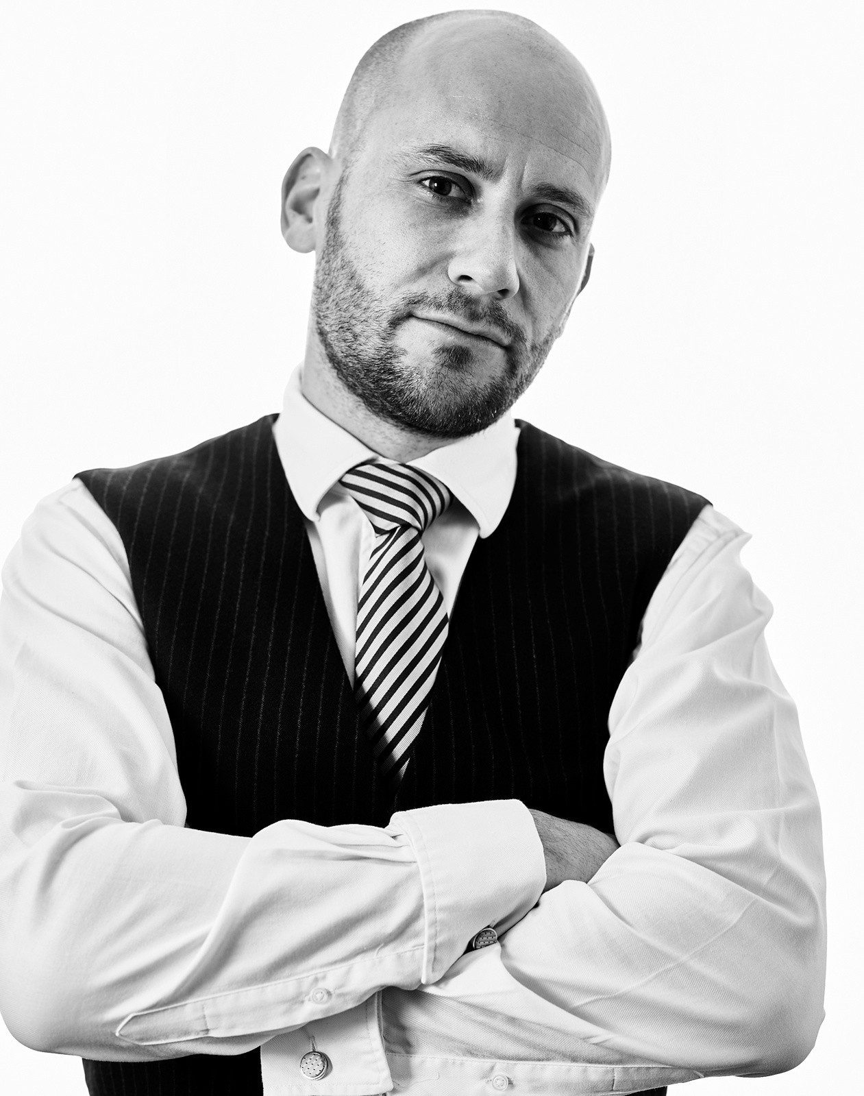 Black and white corporate portrait of a businessman photographed in Matt's Norwich photography studio. Shot by Norwich commercial, freelance portrait photographer Matt Keal.