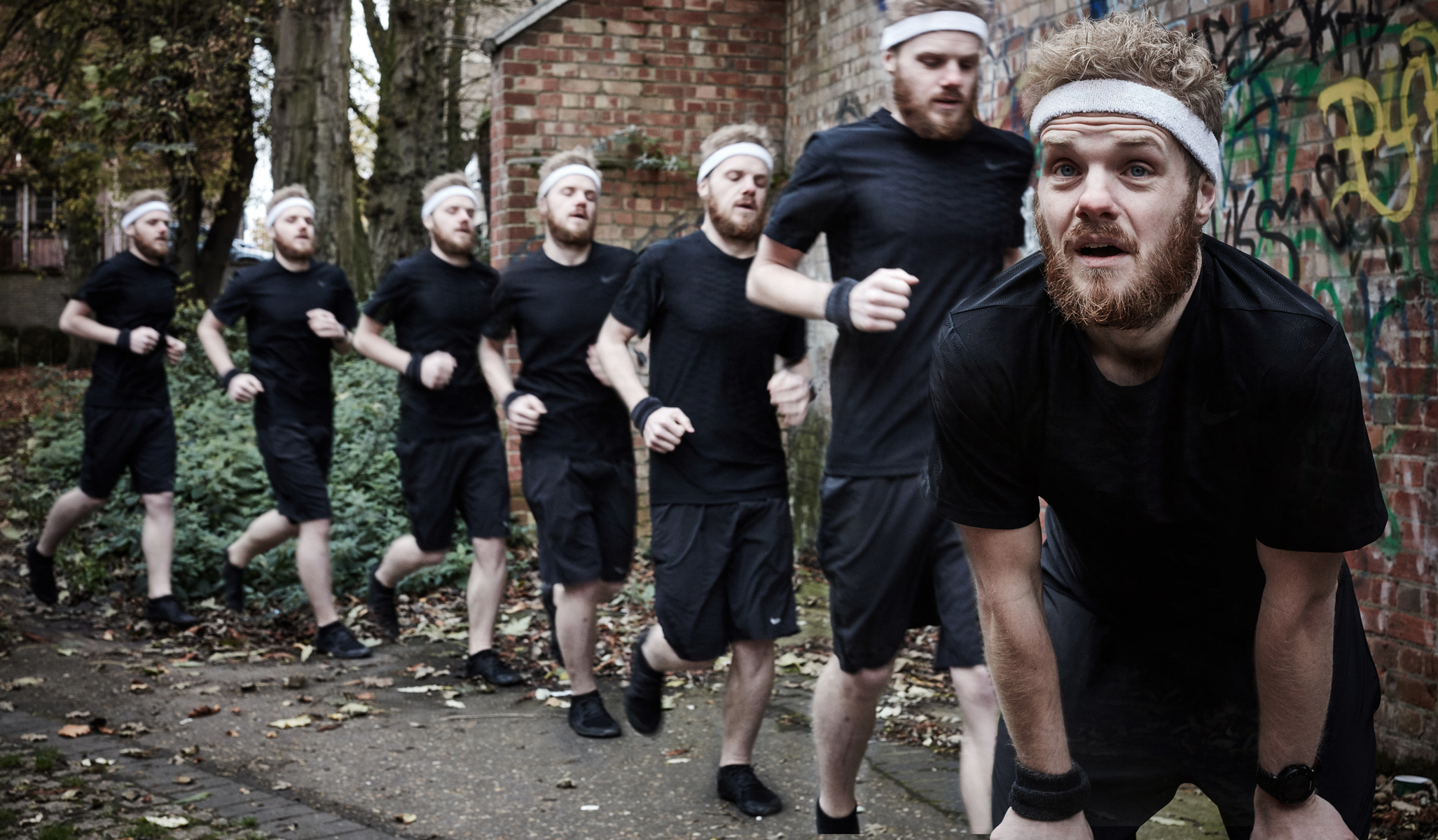 Portrait of a male model running outside with staggered copies of himself behind. Shot by Norwich commercial, freelance portrait photographer Matt Keal.