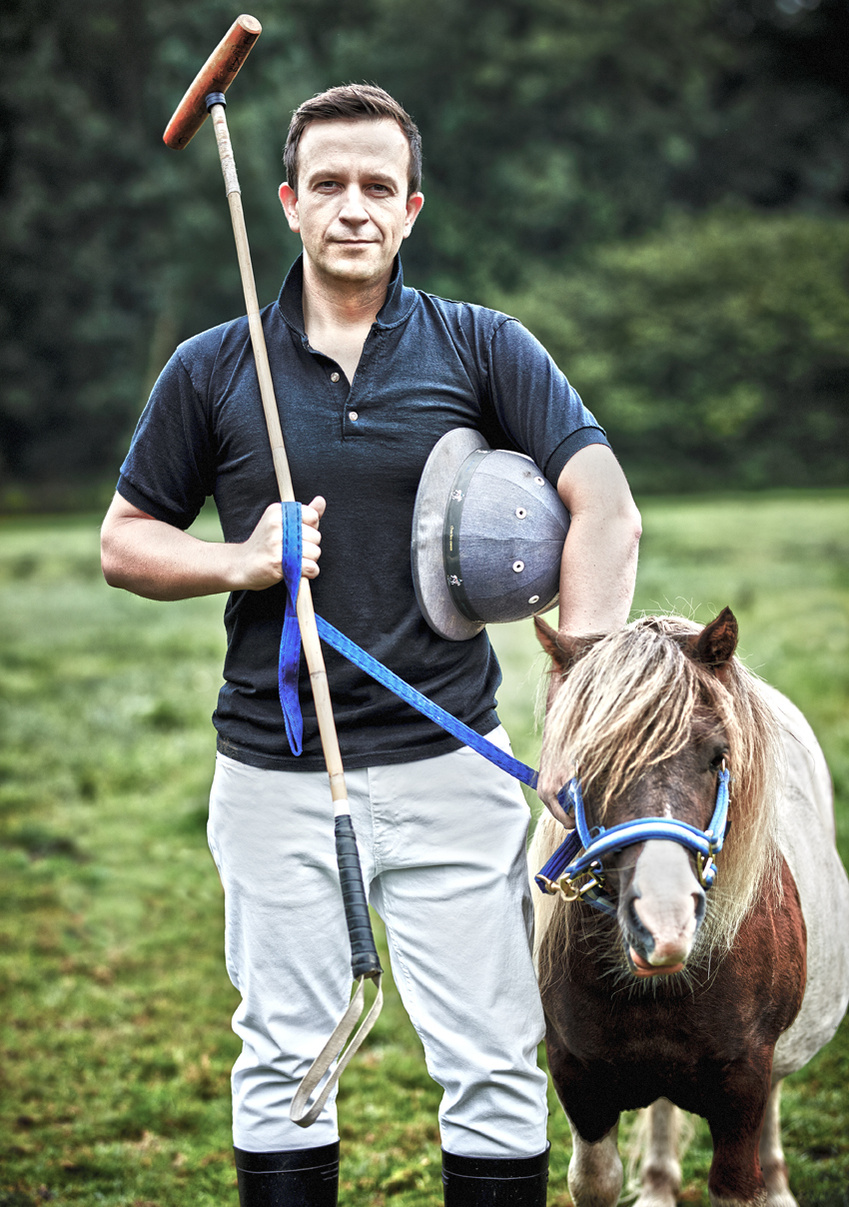 Portrait of a polo player standing with his pony outside for a corporate headshot. Shot by Norwich commercial, freelance portrait photographer Matt Keal.