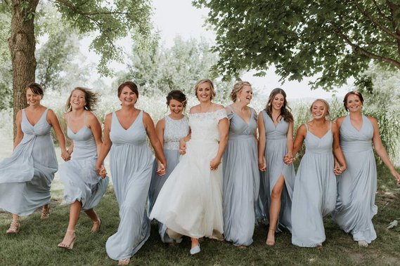 Bride and group of bridesmaids photographed at their wedding in Minnesota