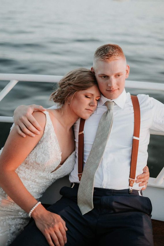 Bride and groom photographed on a boat in Excelsior Minnesota 