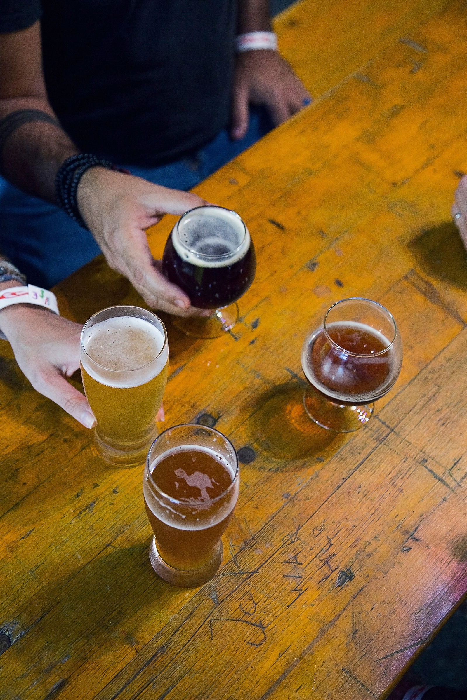 brewery, fellowship, friends, wood, yellow, brown, hands, sharing, happy