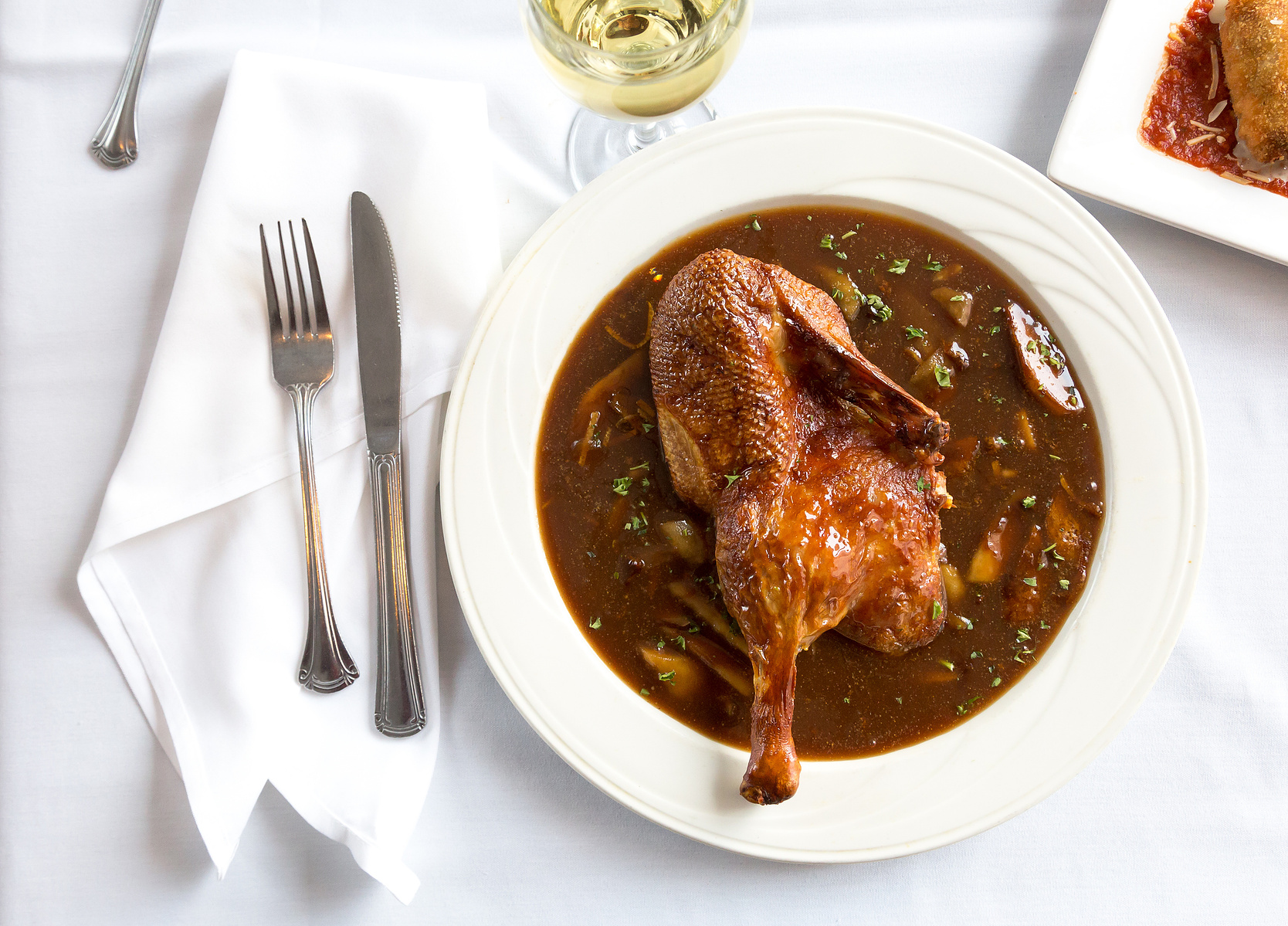 POV, duck, brown, fork and knife, food photographer
