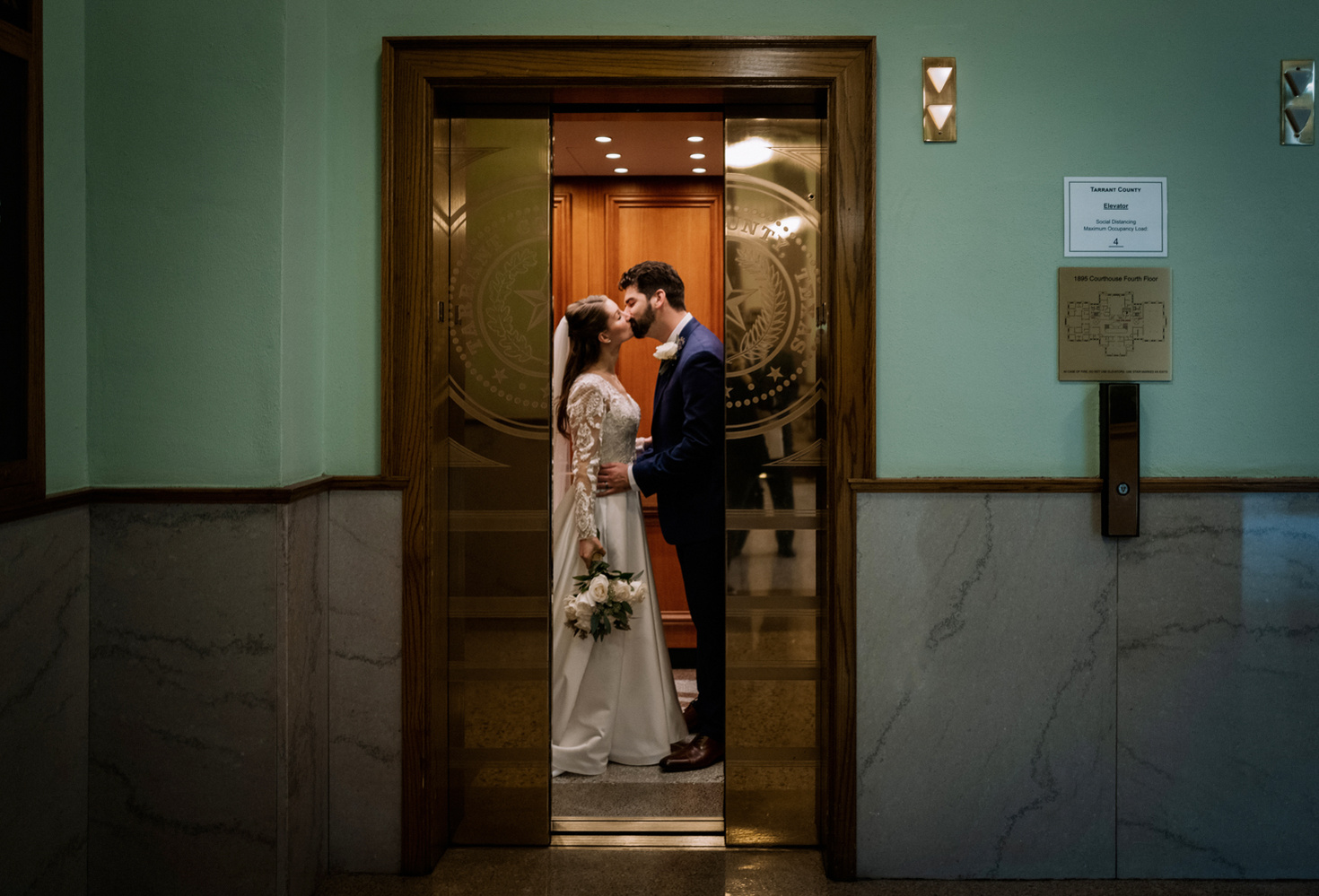Fort Worth Courthouse Wedding On Film Photography Black and White Candid Moments Bride and Groom Elevator 