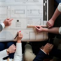 JAW Architects designing a building blueprint photography by Amber Shumake studio photographer