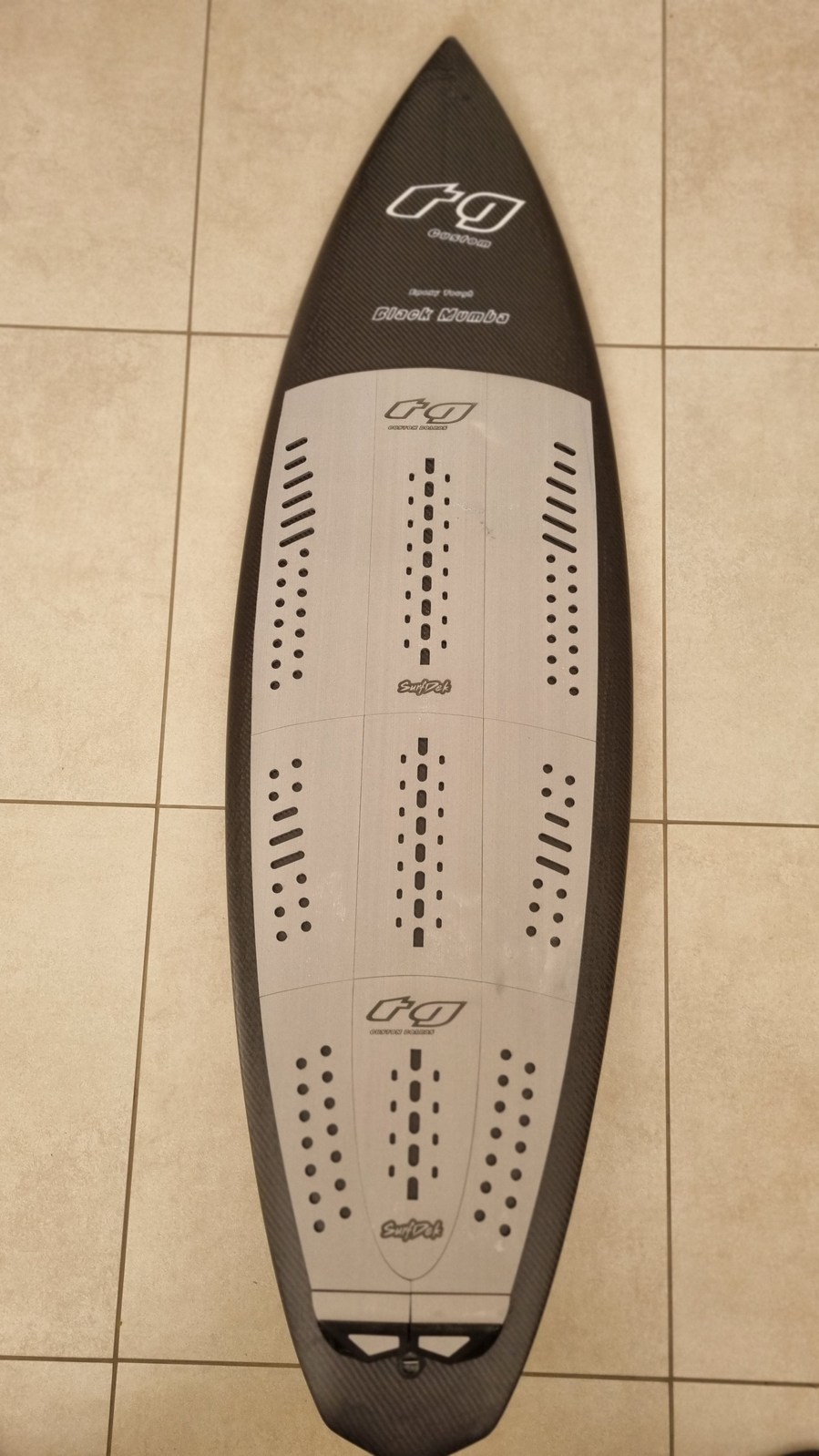 The 'Black Mumba' a full carbon vac bagged board with full deck grip and leash plug. Tri fin set up. Double concave hull, quick to plane. Hard rails towards the tail. The concaved deck. Epoxy tough. Ripper!