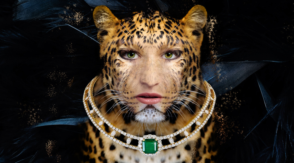 Spectacular composite image of a woman, a leopard, black silky feathers and high jewelry piece of diamonds and large emerald. Creation inspired by iconic jewelry creators Harry Winston and Cartier.