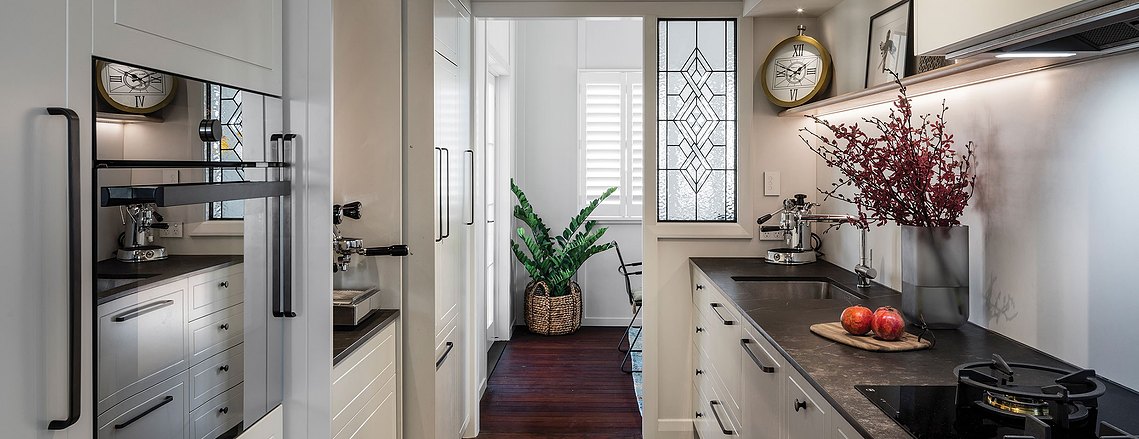 Monochromatic-style kitchen with a gas stovetop, espresso machine and rustic decor