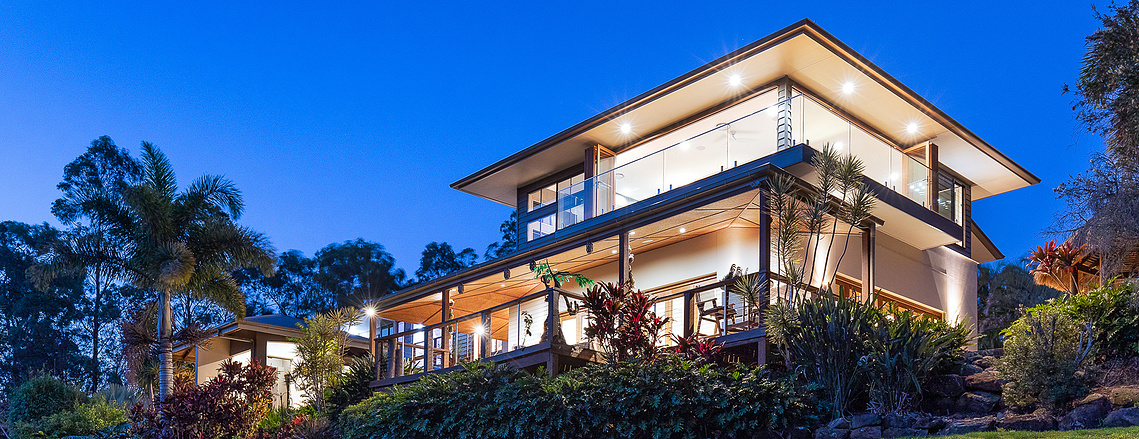 Two storey house sitting at the top of a hill in Upper Coomera at sunset