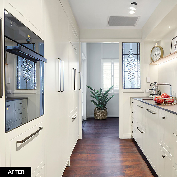 White, modern kitchen with built in oven and plenty of cupboard storage