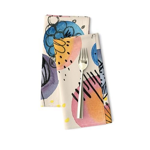 Colorful abstract napkins and placemats designed by artists. 