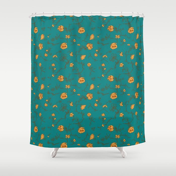 Shower curtain in teal and gold floral pattern with vintage textile theme