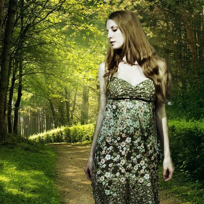 creative Portrait of a Woman in forest
