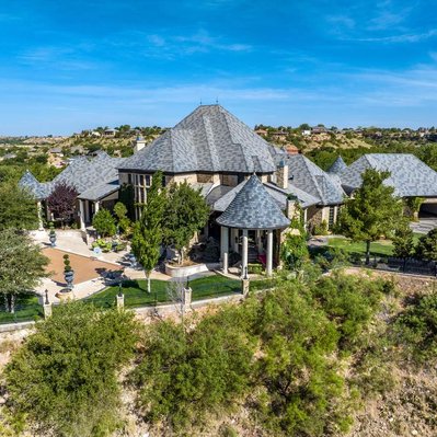 Drone Photograph of a Grand Home on a cliff at Lake Ransom Canyon near Lubbock, Texas.