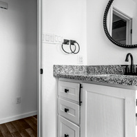 Photos of bathroom in House Near Anton, Texas with lots of Black and Whites