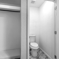 Photos of bathroom in House Near Anton, Texas with lots of Black and Whites