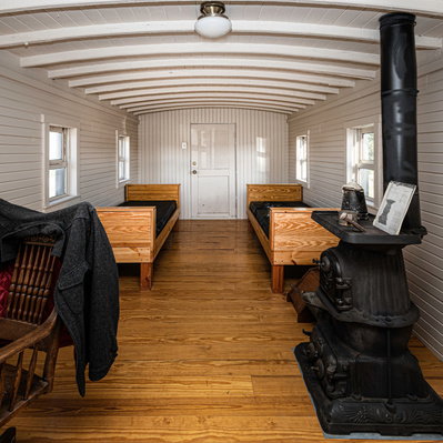 Photograph of Inside of Restored Caboose in front of the Harvey House