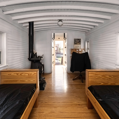 Photograph of Inside of Restored Caboose in front of the Harvey House