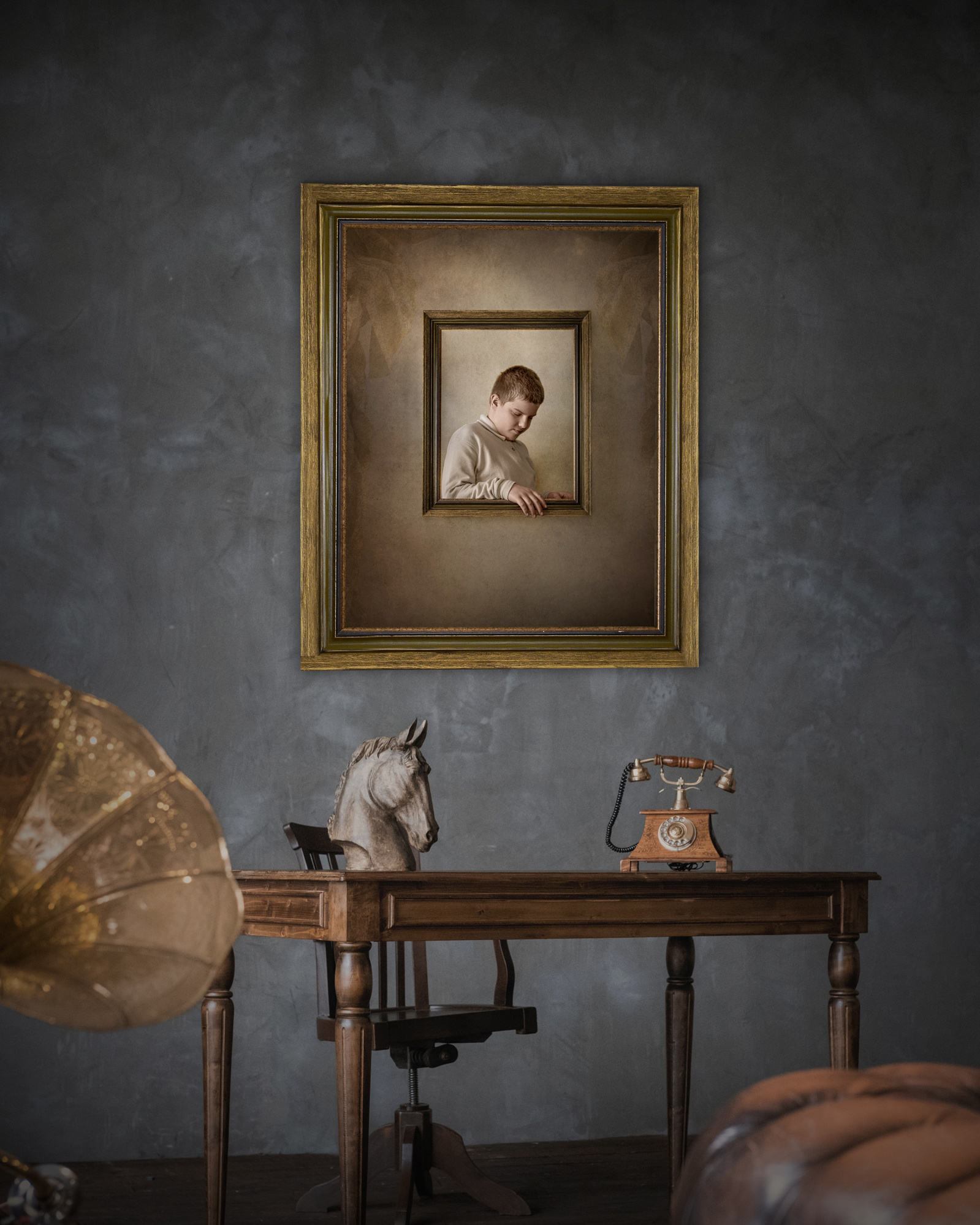 Portrait of a boy in a golden wood frame