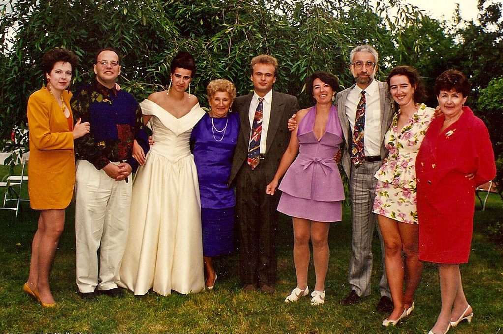 Outside wedding family group picture with the bride and groom