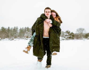 Couple's photos: piggy back ride in the snow, Cape Cod. Photography by Ivan Djikaev/Mind On Photography