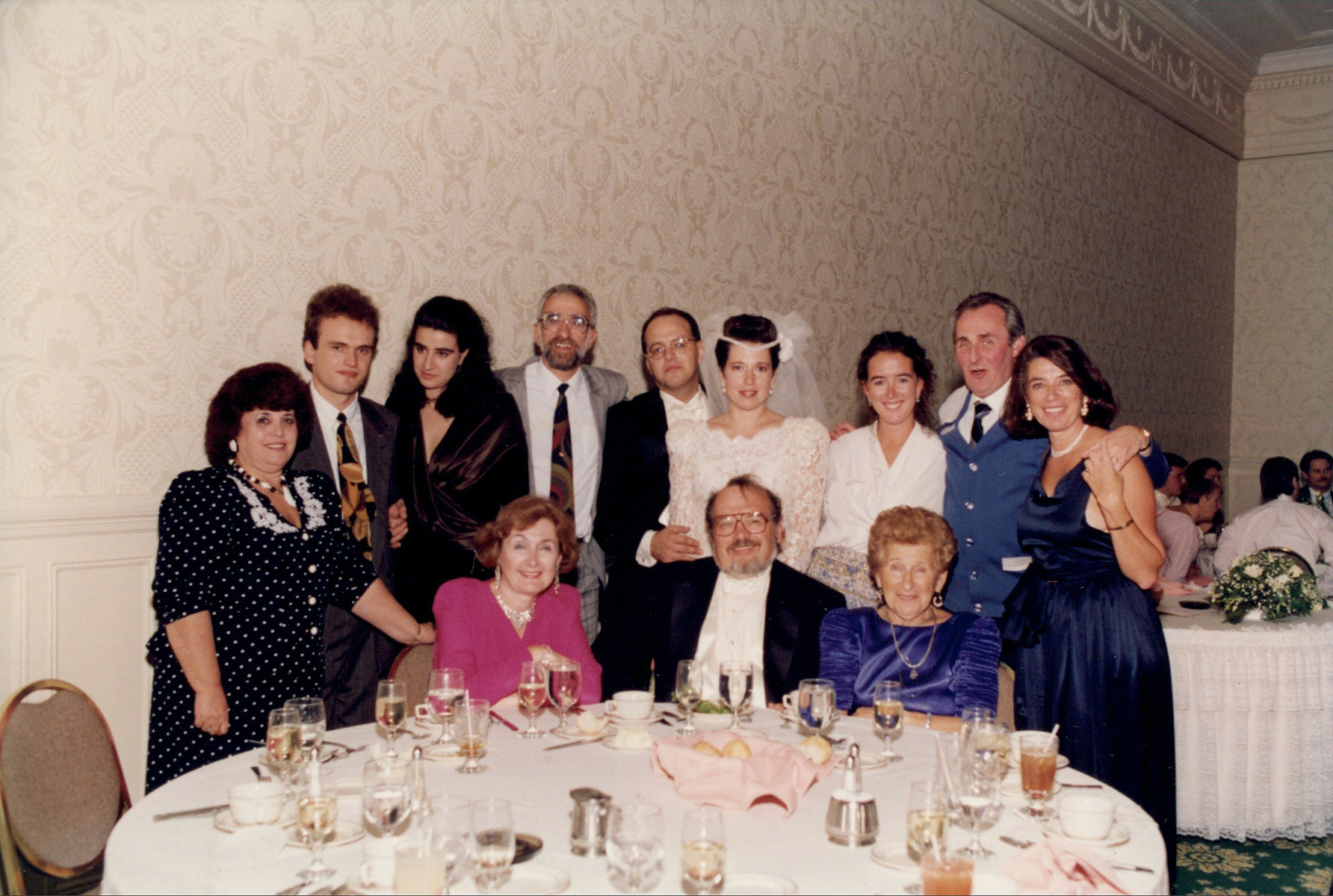 Wedding family group photo at a table