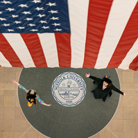 unique and creative photo of two women celebrating graduation from college