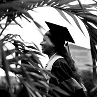 Creative graduate portrait of a woman in Boston Public garden