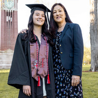A student from the west coast posing with her mom for graduation portrait on campus of Brown University 