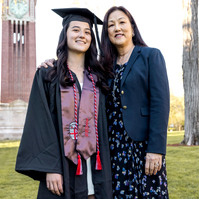 A student from the west coast posing with her mom for graduation portrait on campus of Brown University 