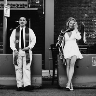 Candid BW shot of a couple celebrating college graduation in Boston, MA