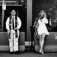 Candid BW shot of a couple celebrating college graduation in Boston, MA