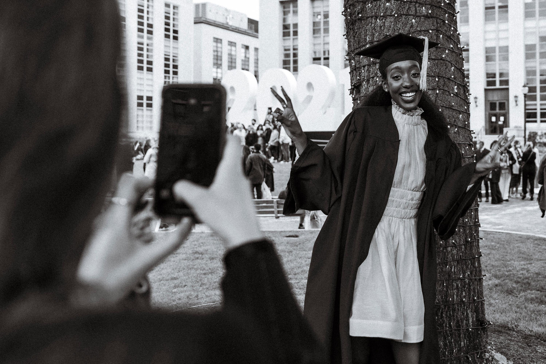 Friend takes picture of a Northeastern University graduate