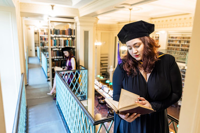 Grad reading in library professional photo Boston