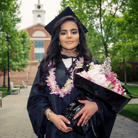Bentley graduate with a bouquet