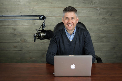 A real estate podcast host in office corporate photo Centerville, Cape Cod.