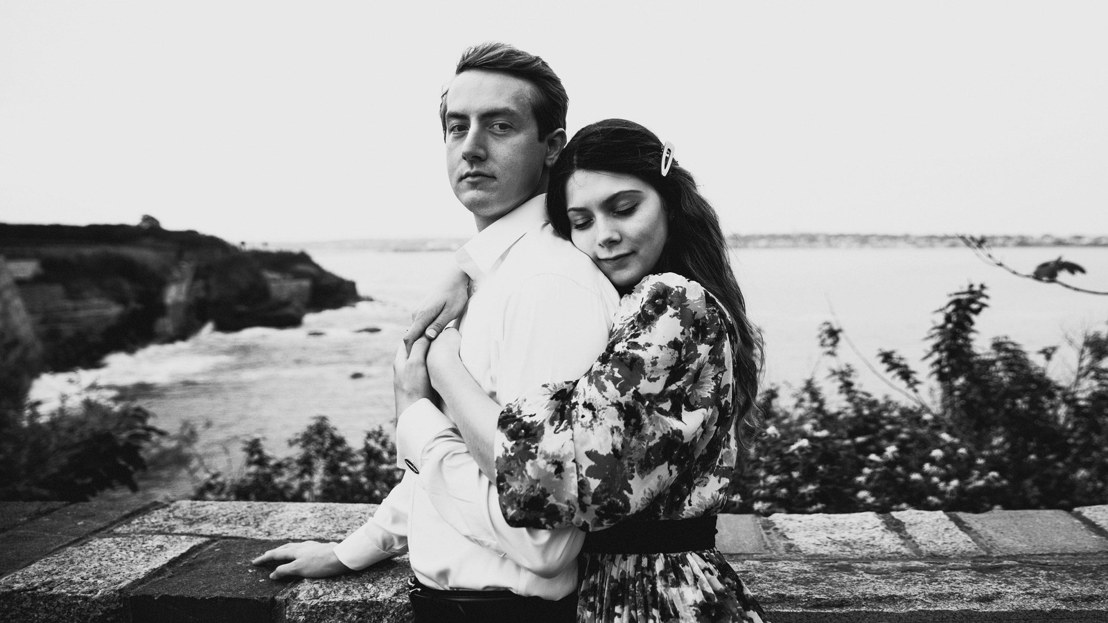 Engaged couple on a Cliff Walk in Newport, RI. Couple's photographer Ivan Djikaev/Mind On Photography