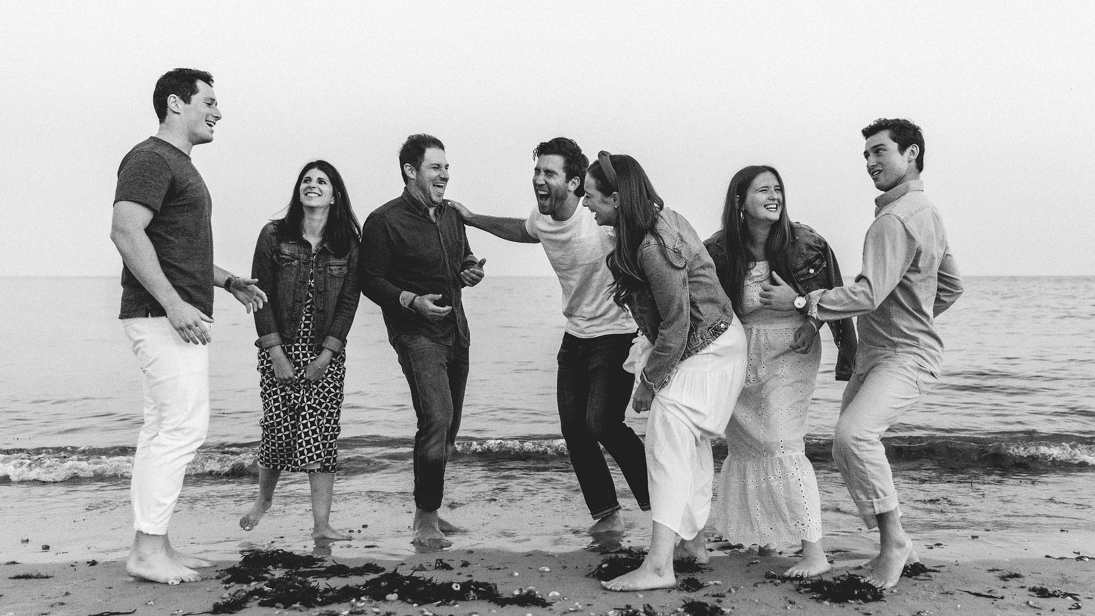 Black and white picture of young people on a beach
