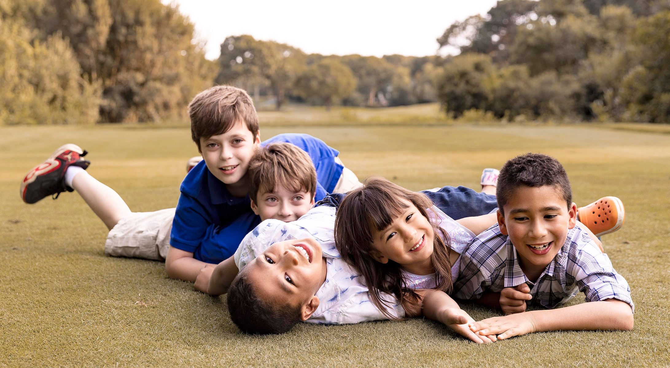 children are having fun on the grass